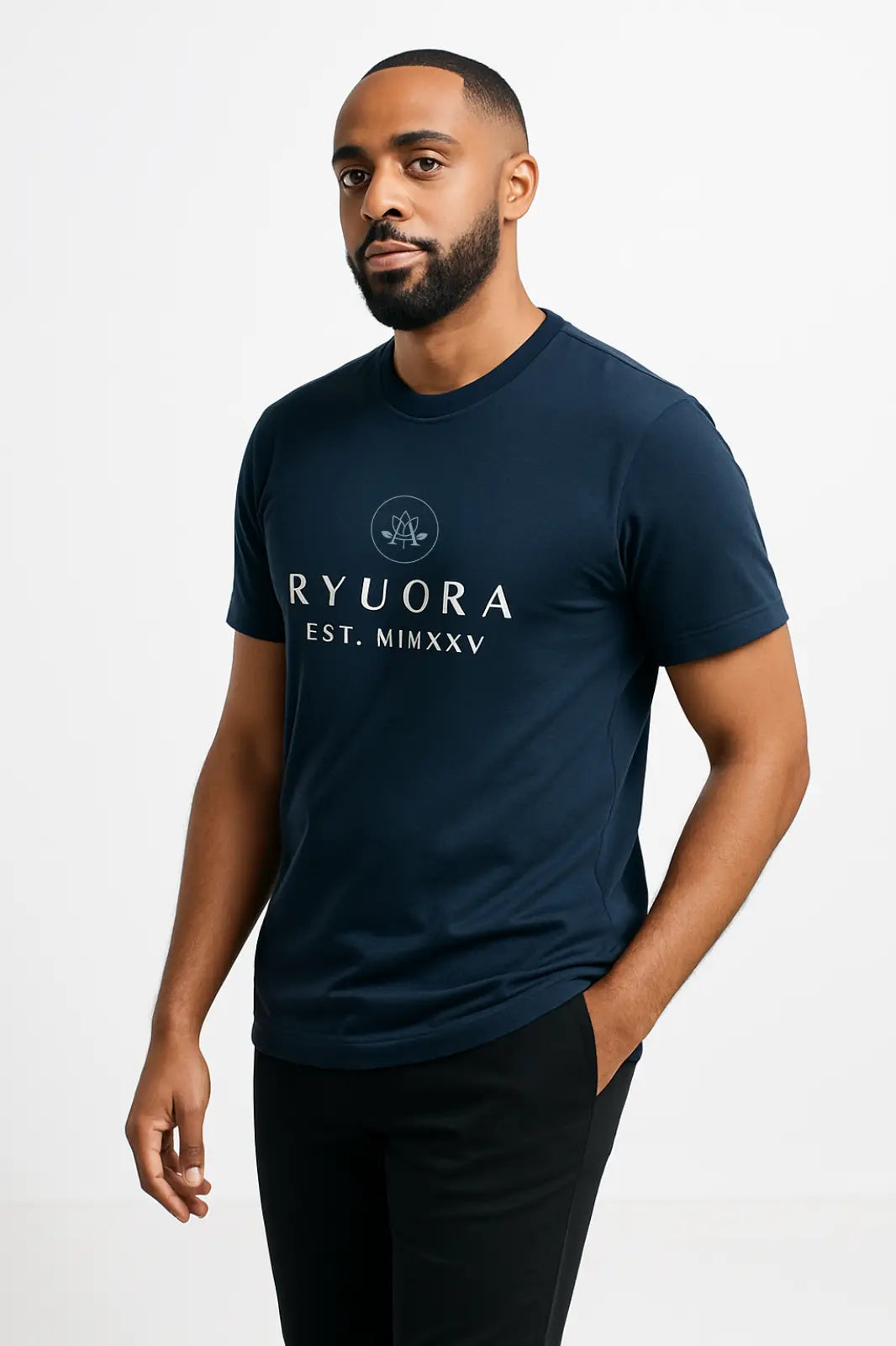 Man wearing navy RYUORA T-shirt with logo and Roman numerals, standing against white background