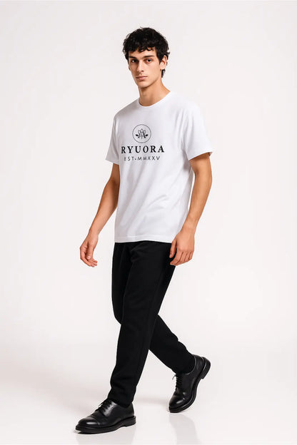 Male model wearing white RYUORA logo t-shirt, black pants, and black dress shoes on white background